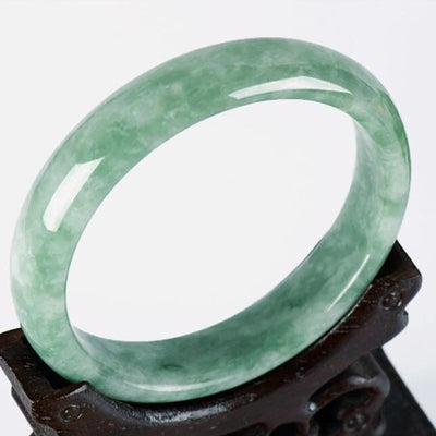 Jade bangle, carved, emerald-green color, for women