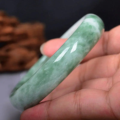 Jade bangle, carved, emerald-green color, for women