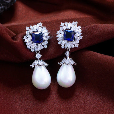 Drop earrings with simulated pearl and blue cubic zirconia for women