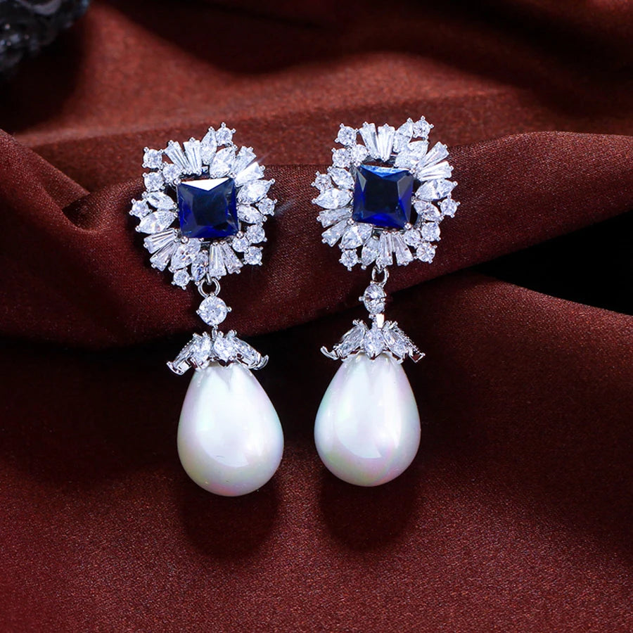 Drop earrings with simulated pearl and blue cubic zirconia for women