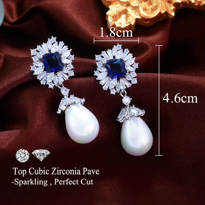 Drop earrings with simulated pearl and blue cubic zirconia for women