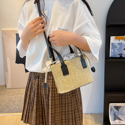 Bucket bag woven from straw for women